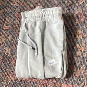 Nike light blue sweatpants. One of the drawstrings fell off, shown in picture 3.